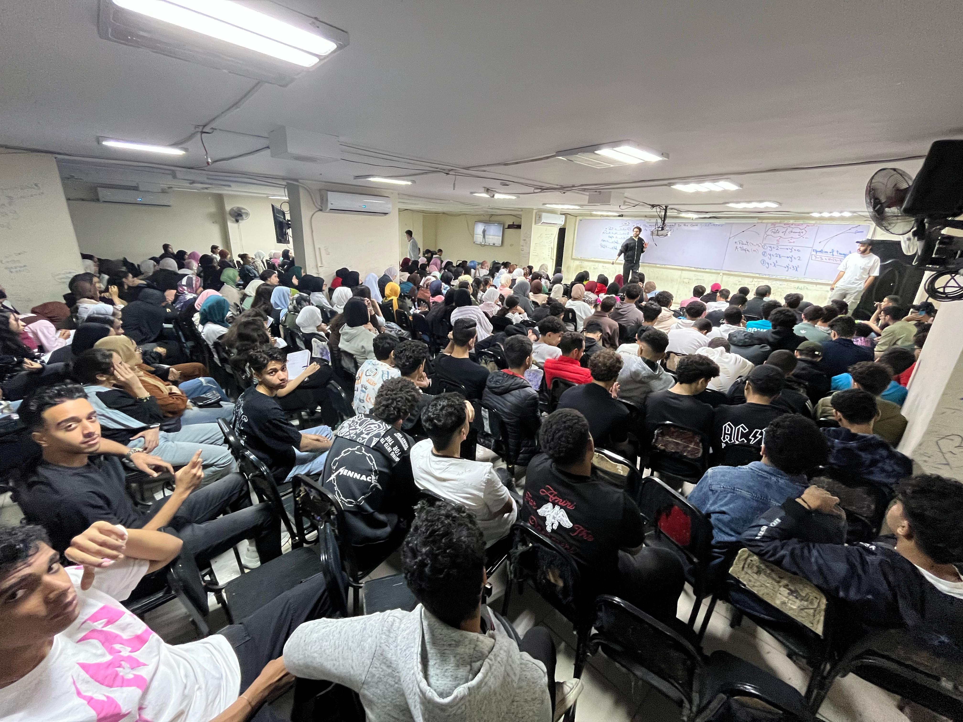 Students attending a packed mathematics lecture