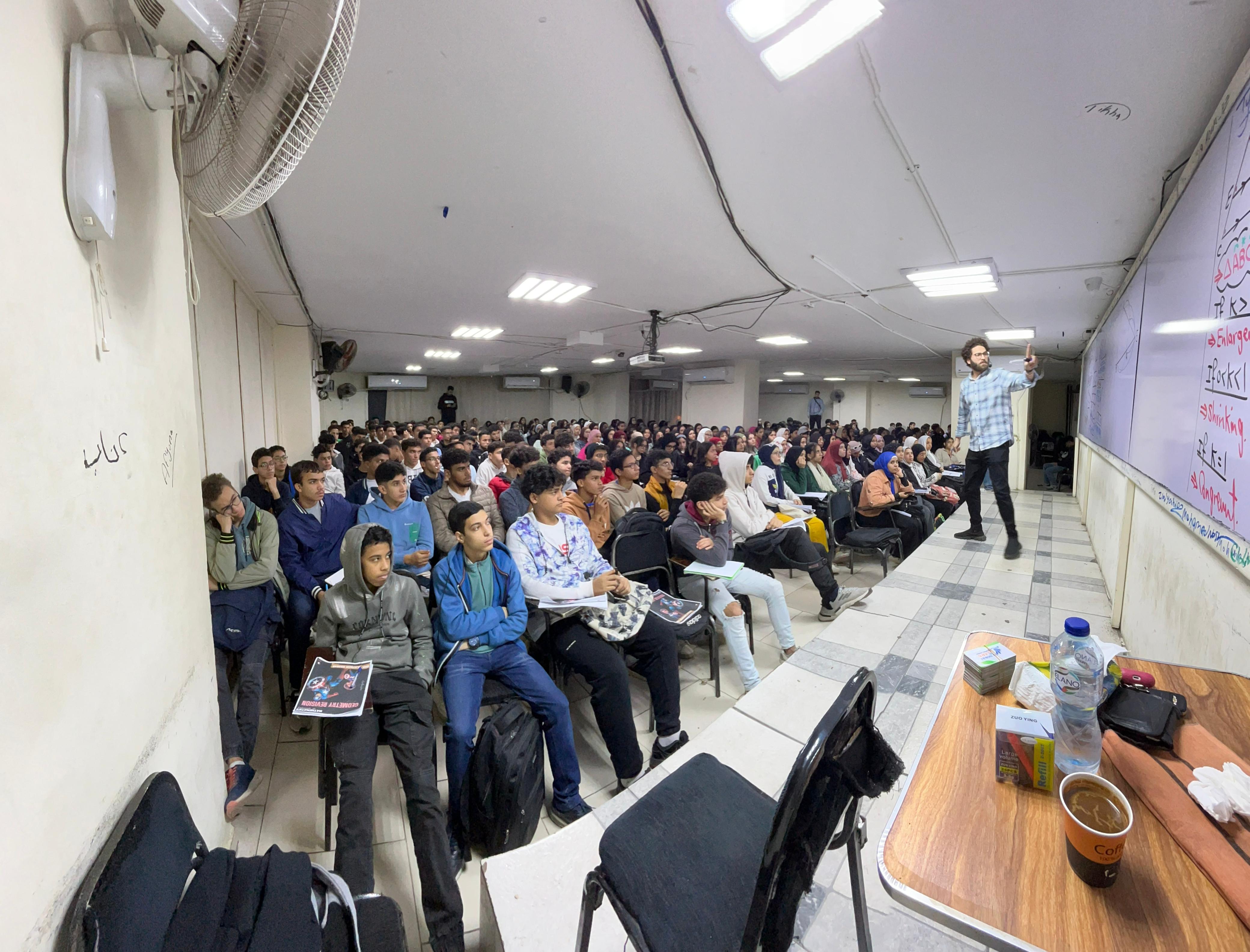 Mr Alayman Hassan speaking to students during a live lesson